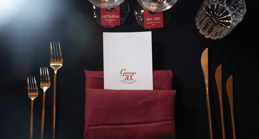 Overhead shot of table setting at Grange 70th event.  