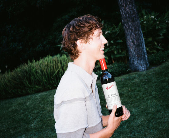 Troye Sivan holding Bin 389