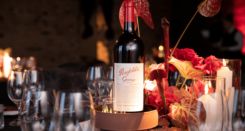 Grange 2017 wine bottle sits in the centre of dining table