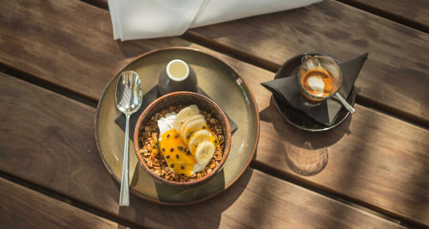 Magill Estate Kitchen breakfast muesli with fruit and an espresso shot overhead